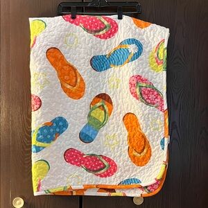 No brand white quilted flip flop blanket. White with different color flip flops